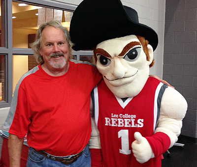 Scott Sheley poses with mascot Rooty Rebel.