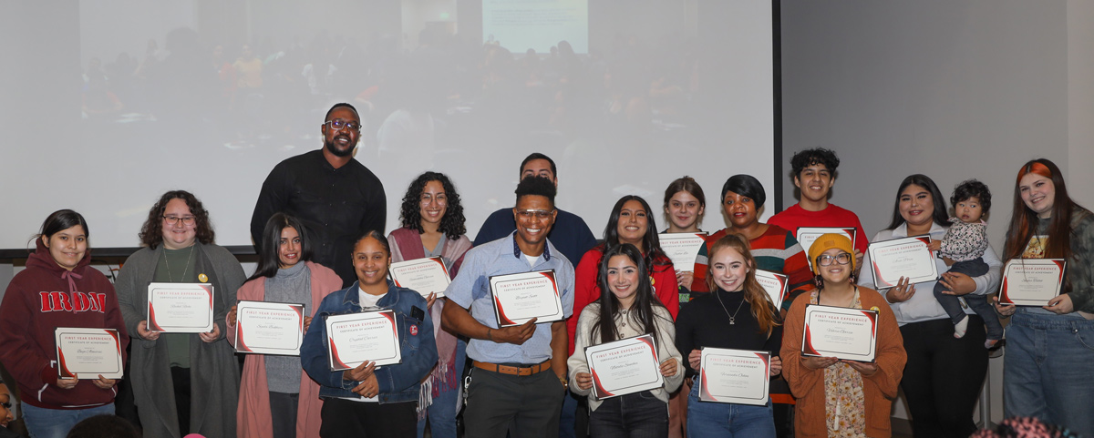 First-Year Experience Posed Group Photo; students hold certificates of achievement