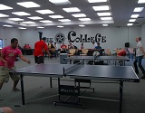 Male students playing ping-pong