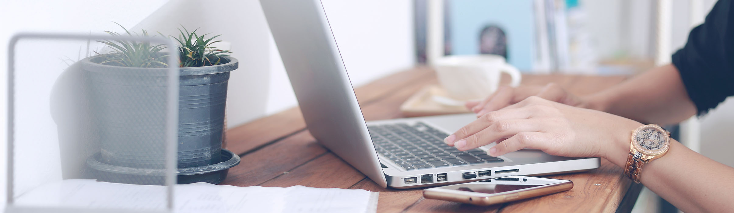 A laptop and other tech devices on a table