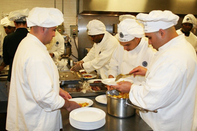 Offenders cook as part of a culinary arts program.