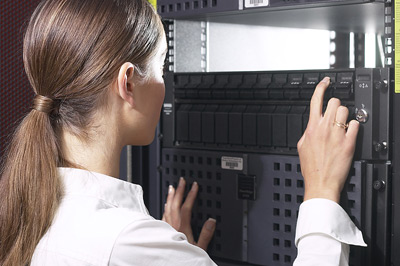 Woman maintaining a computer