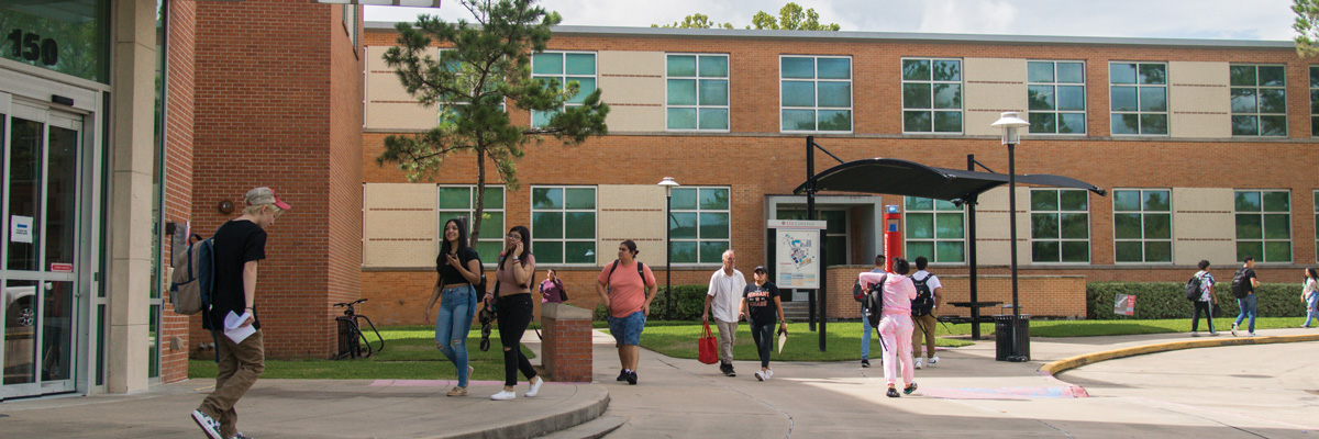 Students walking on campus near Rundell Hall