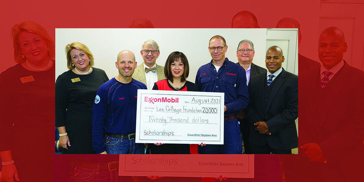 Posed donation photo with large check