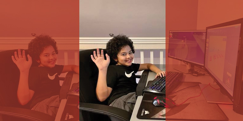 Ethan, 10, learns JavaScript while participating in a virtual summer kids camp via computer.