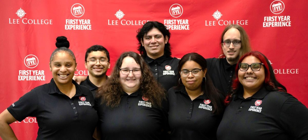 A row of peer mentors posing for the camera