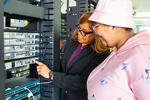 Dr. Carolyn Lightfoot demonstrates a server stack