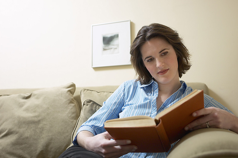 A female student reading a book