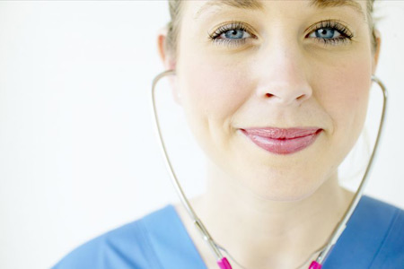 Smiling female nurse with stethoscope