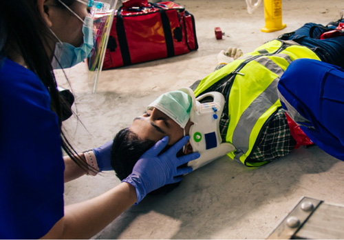 An injured worker receives medical attention