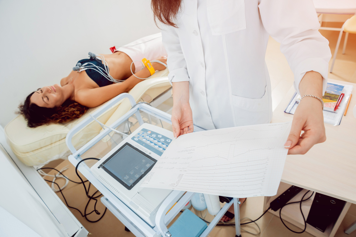 A patient lies on a table to receive a medical exam