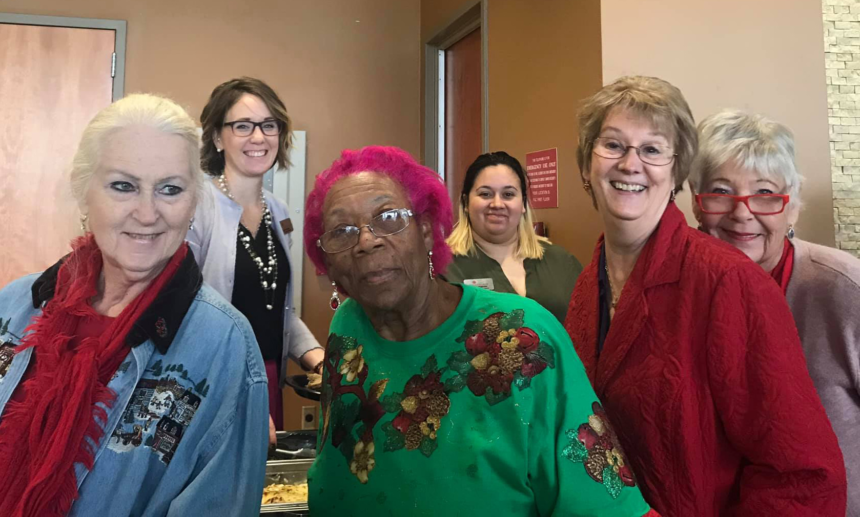 Photo of three Red Hat ladies posing at a table